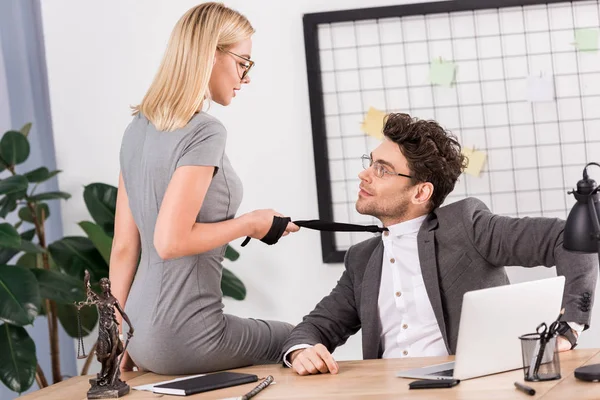 Young Businesswoman Pulling Colleagues Tie While Sitting Table Office Office — Stock Photo, Image