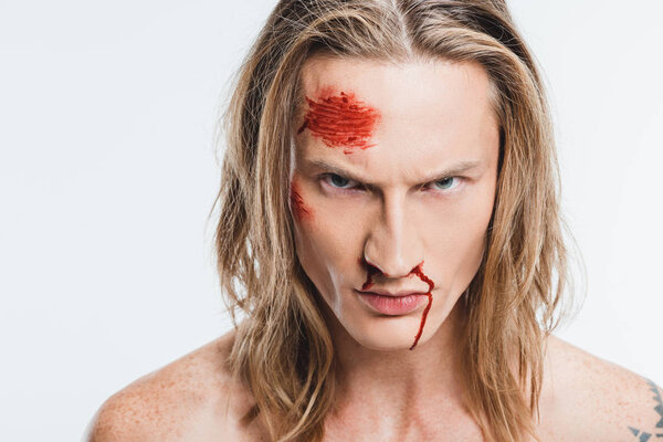 close up of angry man with bloody wounds on face isolated on white