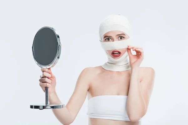 Frightened Woman Bandages Head Holding Mirror Isolated White — Stock Photo, Image