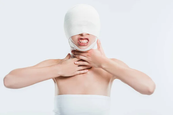 Angry Woman Bandages Head Plastic Surgery Touching Throat Isolated White — Free Stock Photo