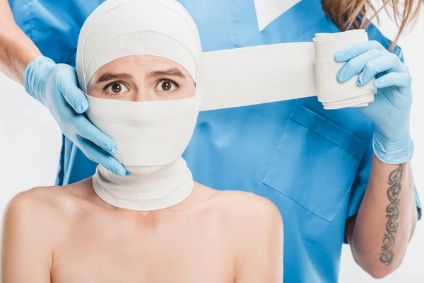 Close Plastic Surgeon Gloves Taping Woman Scared Face Bandage Isolated — Stock Photo, Image