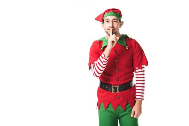 adam Noel elf kostümü gösteren sessizlik sessizlik işareti ve üzerinde beyaz izole kamera bakıyor