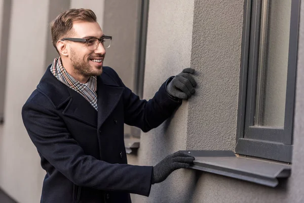Happy Smiling Adult Man Looking Window — Free Stock Photo