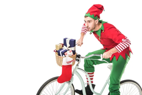 Focused Man Christmas Elf Costume Riding Bike Transporting Presents Basket — Free Stock Photo