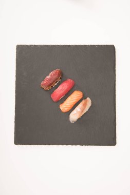 Top view of sashimi sushi on grey slate clipart