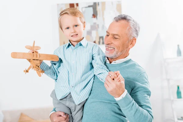 Selective Focus Smiling Middle Aged Man Holding Little Grandson Wooden — Stock Photo, Image