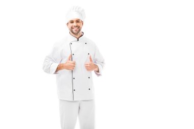 attractive young chef showing thumbs up at camera isolated on white clipart