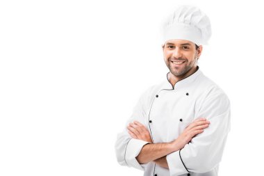 attractive young chef with crossed arms looking at camera isolated on white clipart