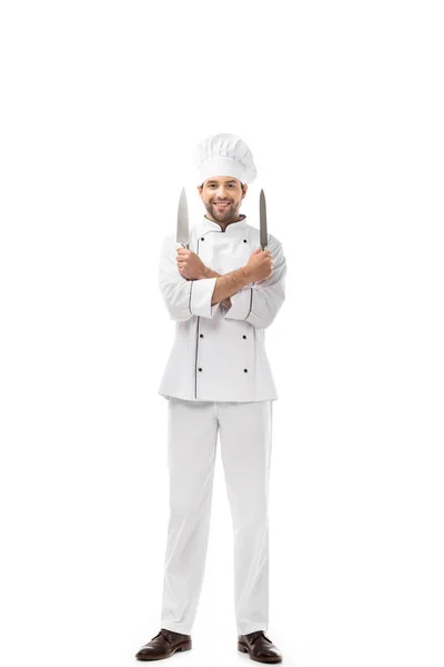 Handsome Young Chef Holding Knives Crossed Arms Smiling Camera Isolated — Free Stock Photo