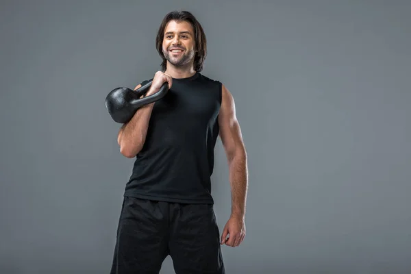 Gelukkig Knappe Jonge Sporter Trainen Met Kettlebell Geïsoleerd Grijs — Stockfoto