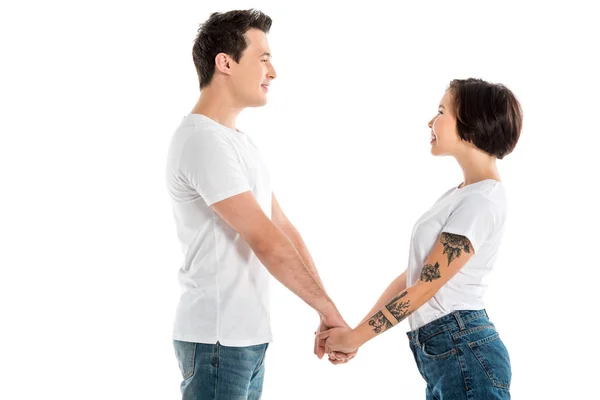 Smiling Couple Holding Hands Looking Each Other Isolated White — Stock Photo, Image