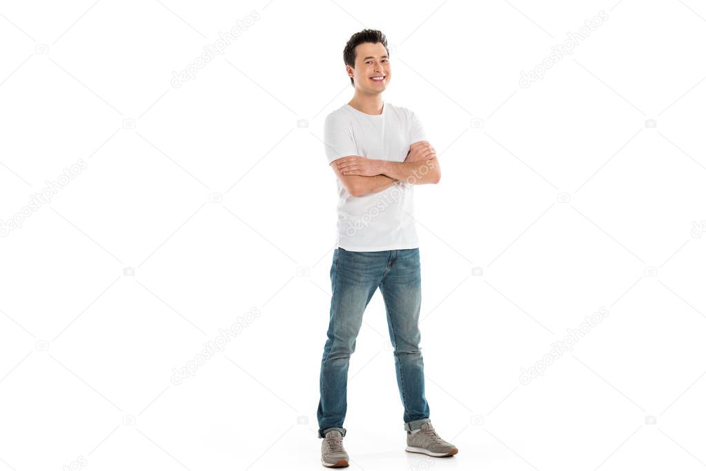 handsome happy man with crossed arms looking at camera isolated on white 