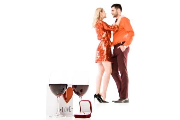 Two Glasses Wine Lovely Postcard Ring Box Background Hugging Couple — Free Stock Photo