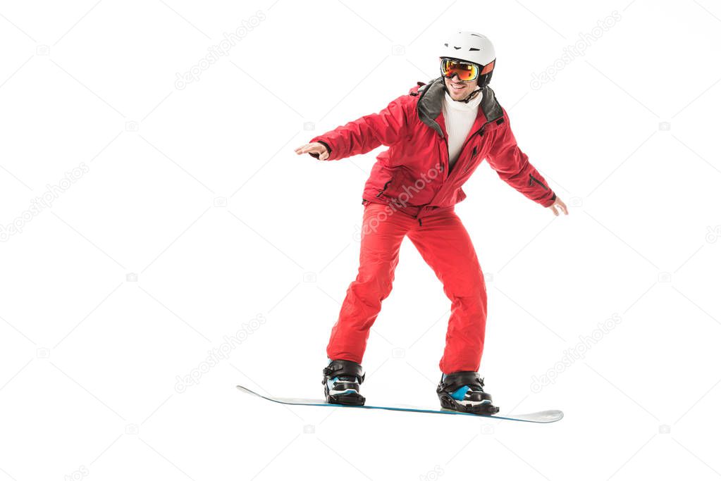 adult man in red ski suit snowboarding isolated on white