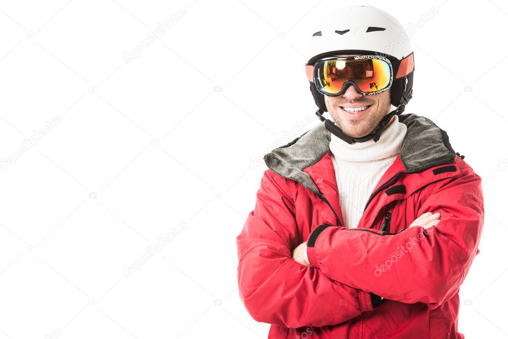 Handsome man in snowsuit smiling and looking at camera isolated on white