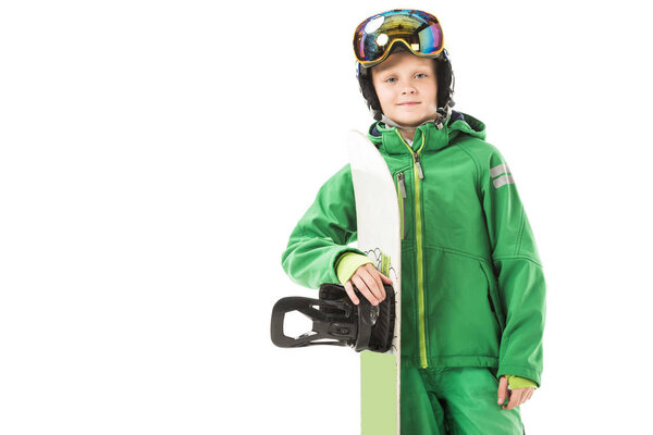 preteen boy in snowsuit with snowboard smiling and looking at camera isolated on white