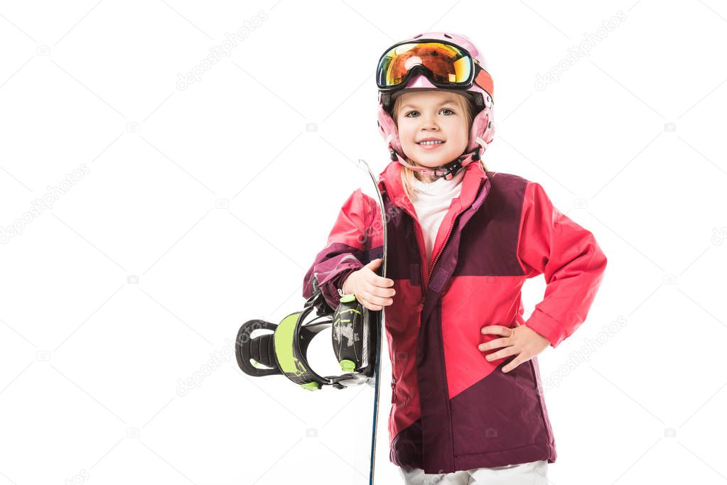 Cute preschooler in ski suit with snowboard smiling isolated on white