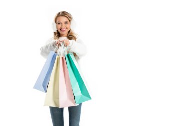 attractive woman in winter outfit holding shopping bags isolated on white clipart