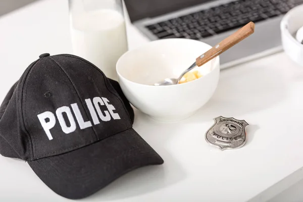 Police Cap Bowl Cornflakes Police Badge Laptop Table — Free Stock Photo