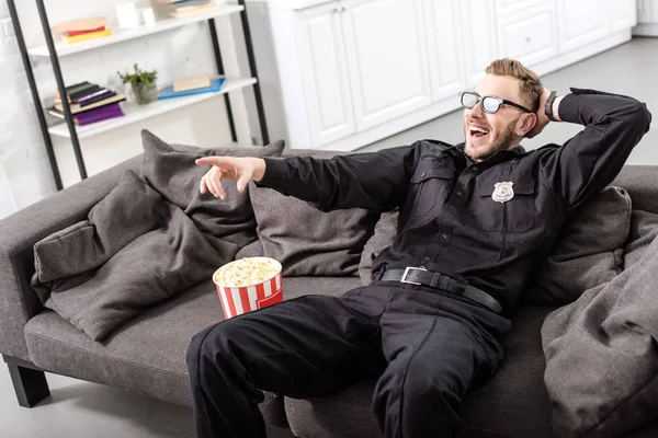 Policeman Glasses Sitting Couch Watching Movie — Free Stock Photo