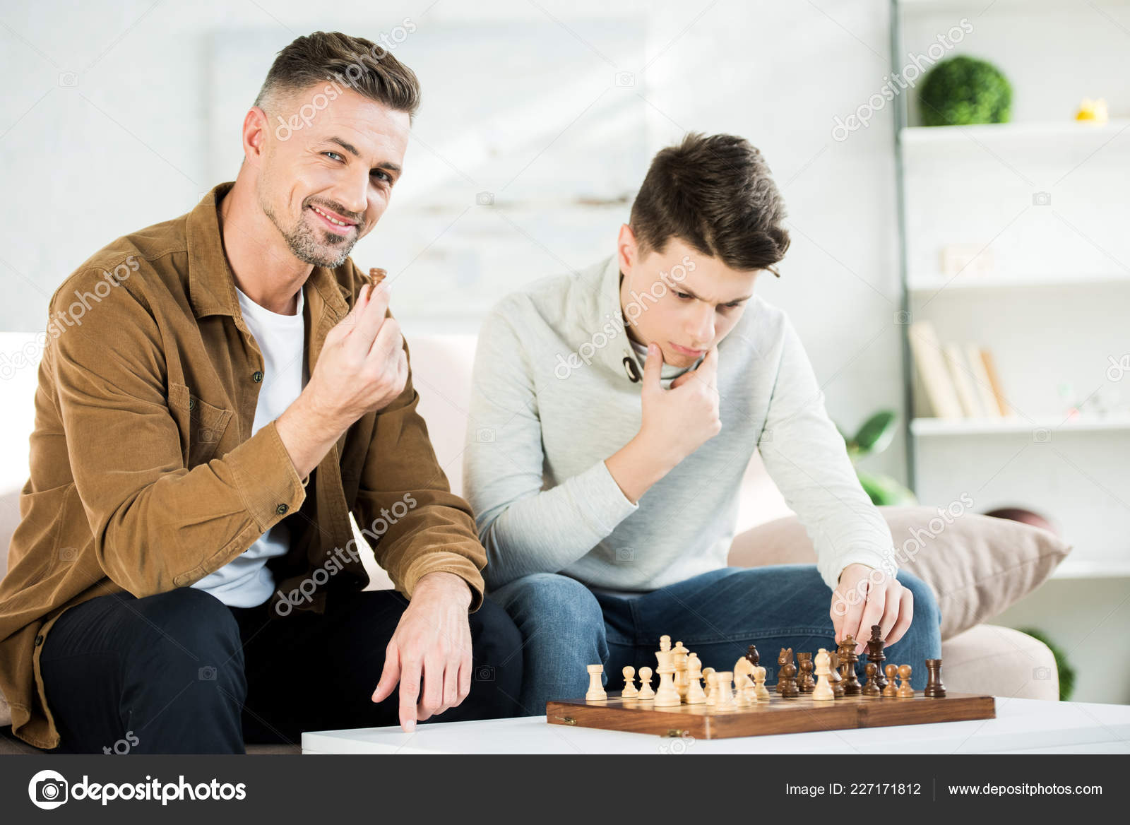 Teenager Playing Chess with his Grandfather · Free Stock Photo