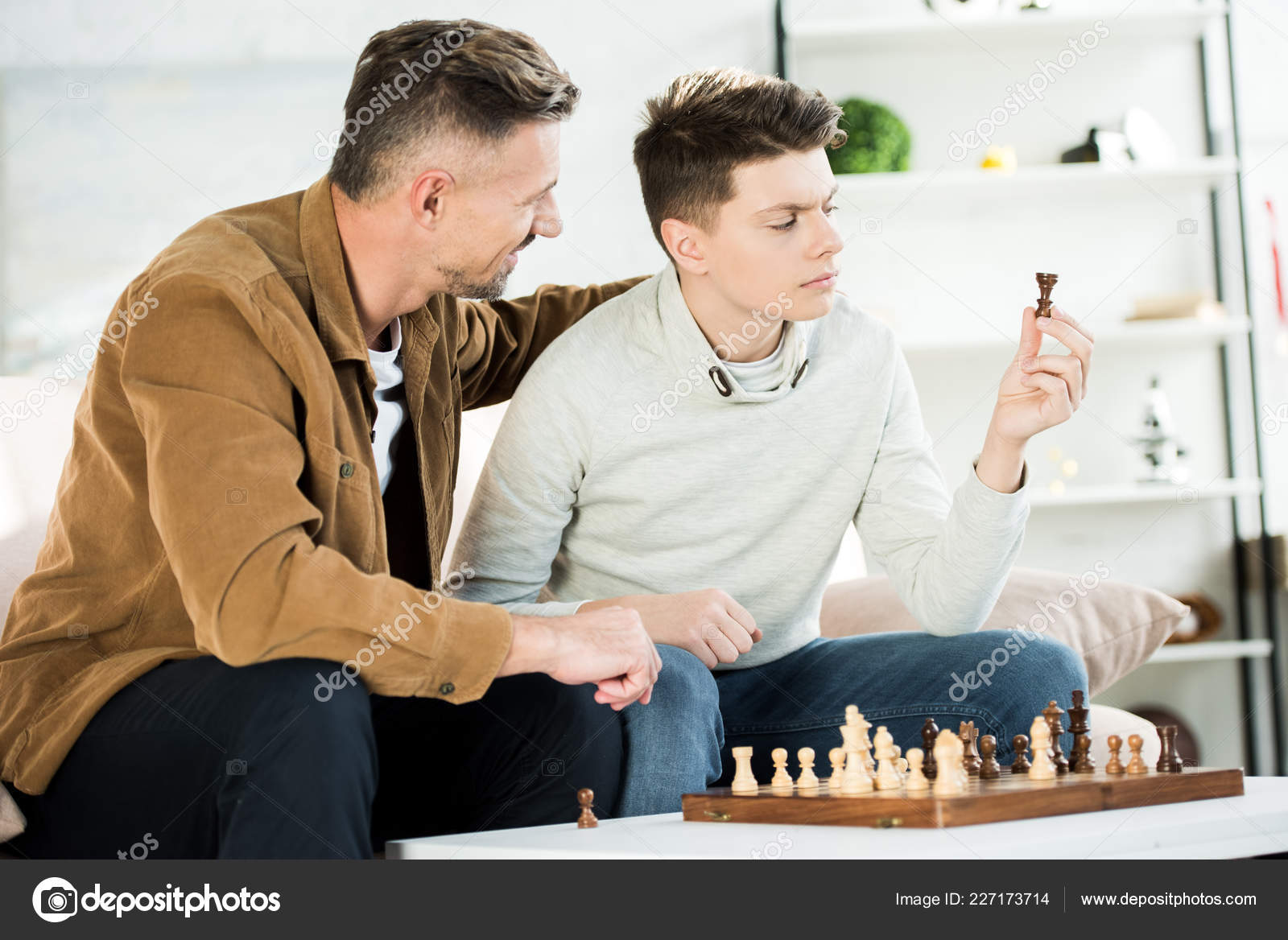 Teenager Playing Chess with his Grandfather · Free Stock Photo