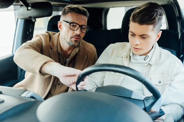 Handsome Father Teaching Teen Son Driving Car — Stock Photo, Image