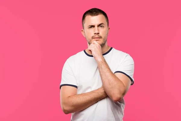 Pensive Young Man Hand Chin Isolated Pink — Free Stock Photo