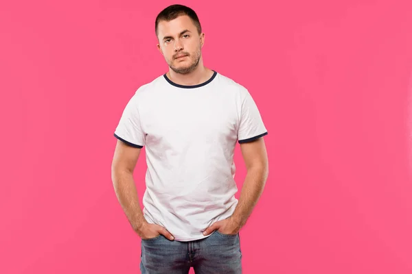 Serious Handsome Young Man Posing Hands Pockets Isolated Pink — Free Stock Photo