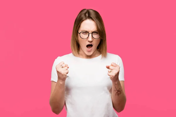 Angry Girl Eyeglasses Standing Raised Fists Isolated Pink — Stock Photo, Image