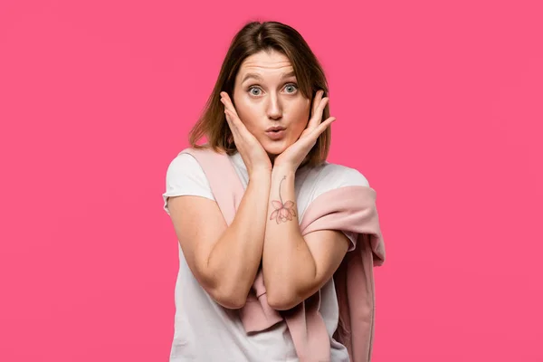 Attractive Girl Looking Camera Hands Cheeks Isolated Pink — Free Stock Photo