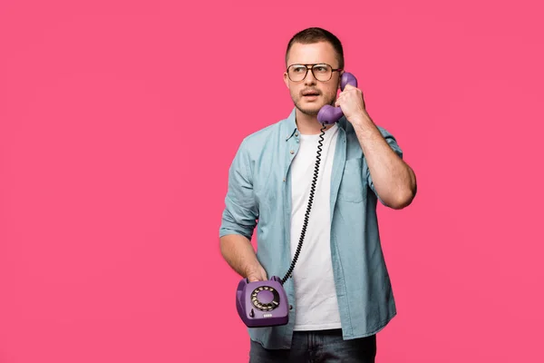 Serious Young Man Eyeglasses Talking Vintage Telephone Isolated Pink — Stock Photo, Image