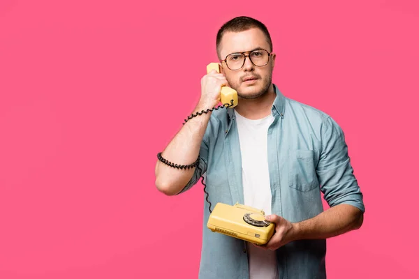 Serious Man Eyeglasses Talking Vintage Telephone Looking Camera Isolated Pink — Stock Photo, Image