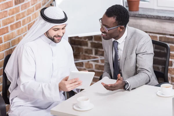 Arabian Businessman Holding Digital Tablet Sitting African American Partner — Stock Photo, Image