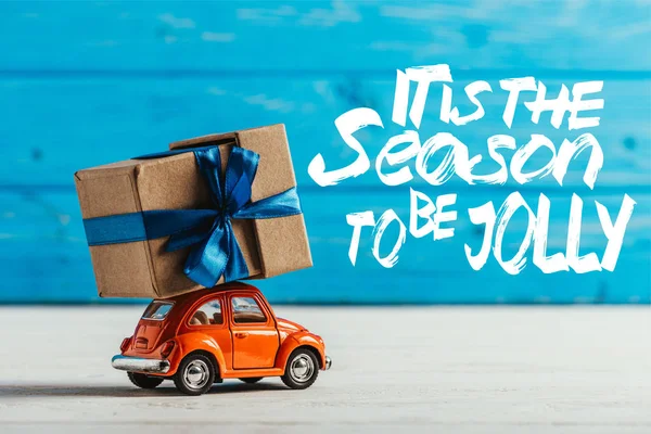 Close Shot Toy Car Gift Box Blue Wooden Background Season — Free Stock Photo