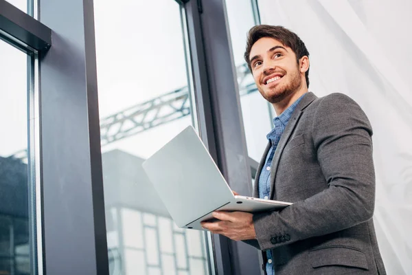 Smiling Office Manager Standing Window Holding Laptop — Stock Photo, Image