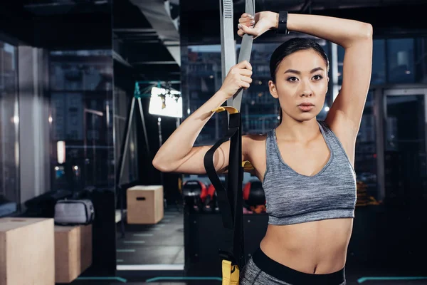 Slim Asian Sportswoman Holding Resistance Bands Gym — Free Stock Photo