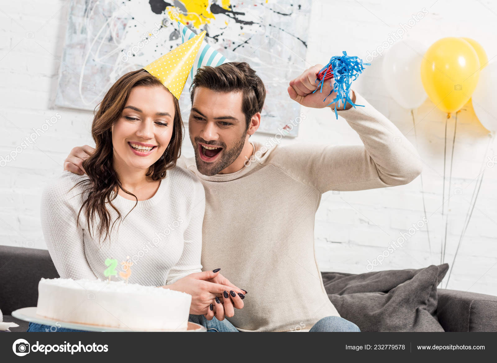Cheerful Couple Party Hats Celebrating Birthday Cake Party
