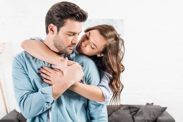 Attractive Woman Hugging Man Home — Stock Photo, Image