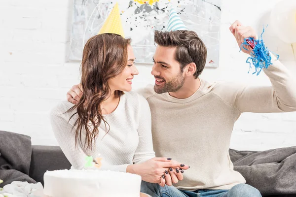 Happy Couple Party Hats Celebrating Birthday Cake Party Horn Home — Stock Photo, Image