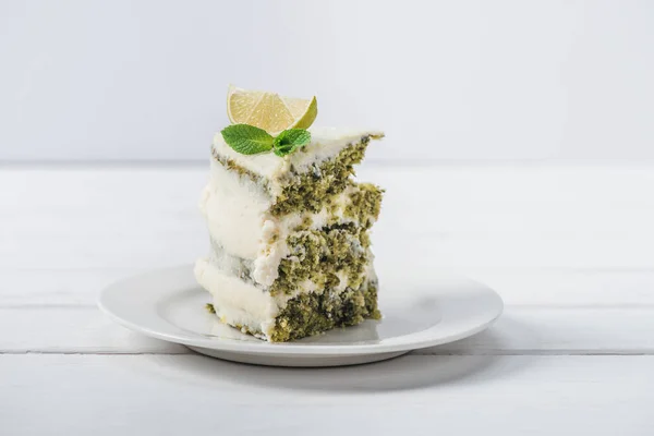 Piece White Cake Decorated Mint Leaves Line Slices Isolated White — Stock Photo, Image