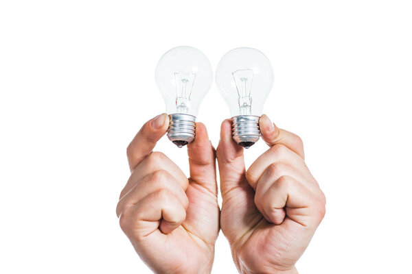 cropped view of led lamps in hands of man isolated on white, energy efficiency concept