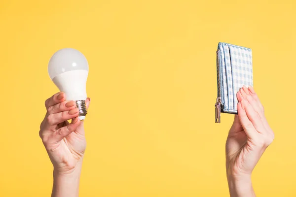 Cropped View Woman Holding Fluorescent Lamp Wallet Hands Isolated Yellow — Stock Photo, Image