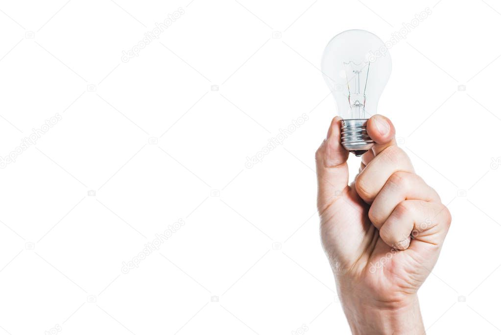 cropped view of male hand holding led lamp isolated on white, energy efficiency concept