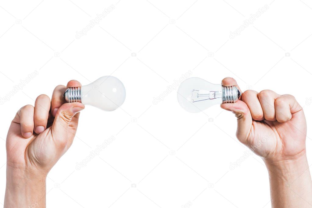 cropped view of led lapms in hands of man isolated on white, energy efficiency concept