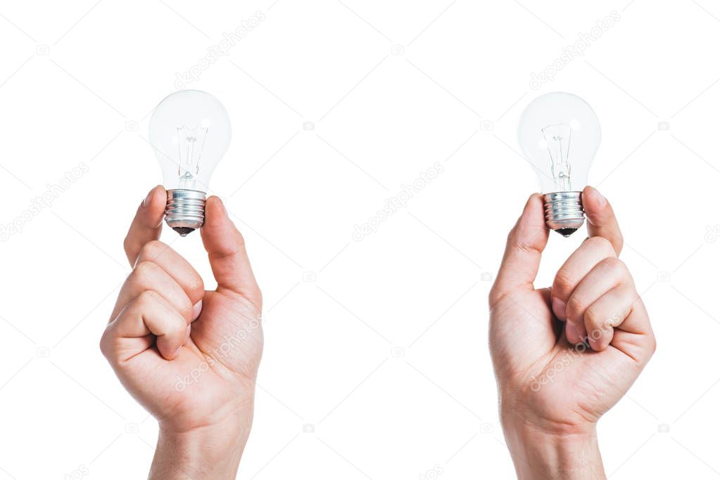 cropped view of led lamps in male hands isolated on white, energy efficiency concept