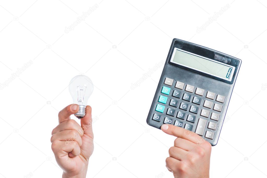 cropped view of male hands holding led lamp and calculator in hands isolated on white, energy efficiency concept 