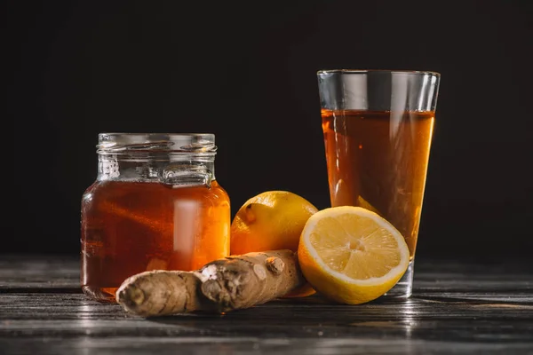 Tea Lemons Ginger Root Jar Glass Wooden Table Isolated Black — Stock Photo, Image