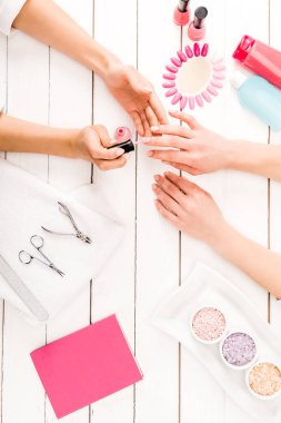 Flat lay with manicure instruments and nail polish palette clipart