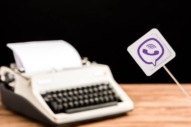 selective focus of viber app icon with typewriter on background clipart